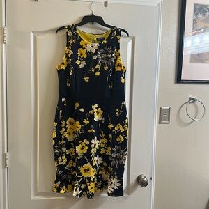 Black, Yellow and grey.  Has back cut out.  Ruffled bottom.